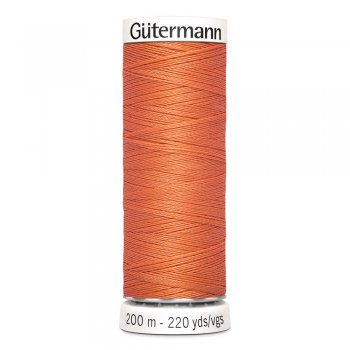 En rulle med orange polyestertråd