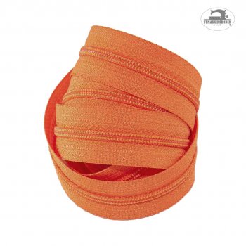En bunt blixtlås i färgen orange
