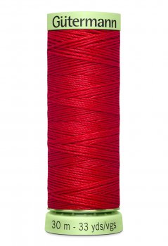 En rulle med röd top stitch tråd