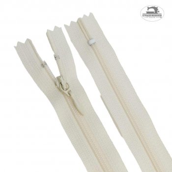 Ett 60 cm långt blixtlås i färgen benvit som passar klänningar och kjolar.